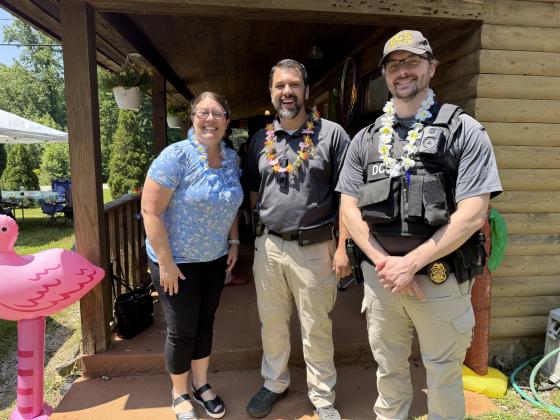 From left, Melissa Alvarez of Black Bear Lodge, Justin Ussery and Henrik Singendonk of the Georgia Department of Correct Services were among those who attended the Luau and toured the Respite Center.