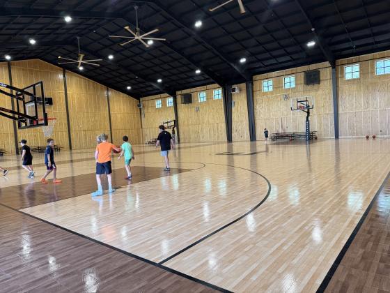Elementary age kids enjoyed basketball at the new barn gym at Woodlands Camp this summer. ERBELE/WCN