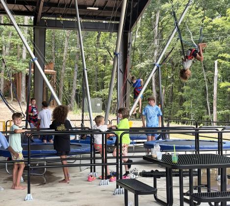 Woodlands campers enjoy the Euro Bungee Trampoline. ERBELE/WCN