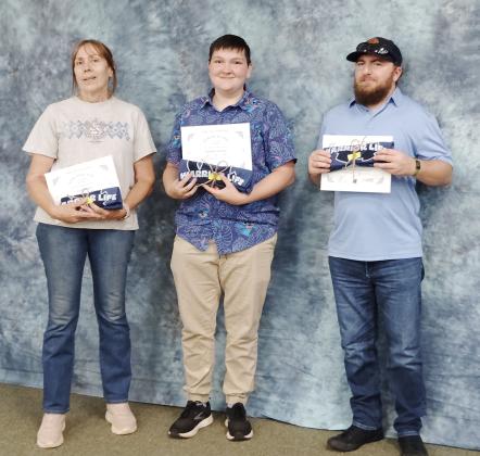 School nutrition staffers Lyn Johnson, Easton Turner and Madison Scobee are recognized for perfect attendance.