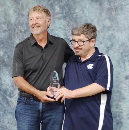 The late Kay Head was posthumously awarded the 2026 Philip Wright Award. Her husband, Doug Head, and son, Brian Head, accept the award in her memory.