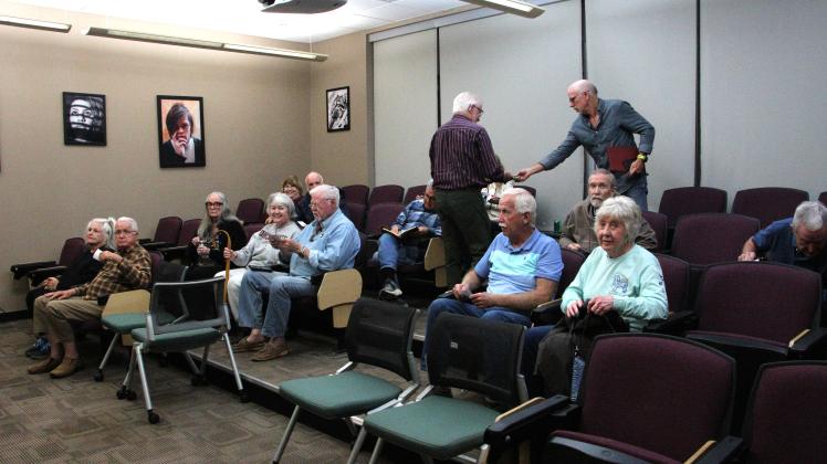 Members of the Foothills Photography Group participate in a discussion on AI and photography. MAE SULLENS/CNI