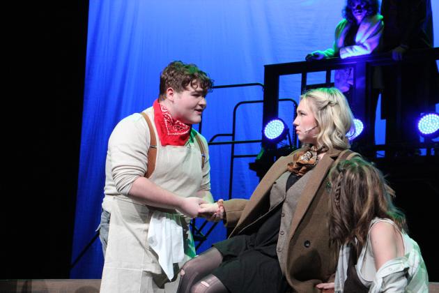 Orpheus (Nix Pulliam) attempts to persuade Eurydice (Paityn Fain) to marry him.