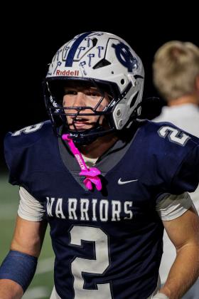 Zach Godfrey turned a 10-yard pass into a 98-yard scoring play in the fourth quarter to lead the Warriors to a 34-33 region win.  JENNIFER KNIGHT/SPECIAL