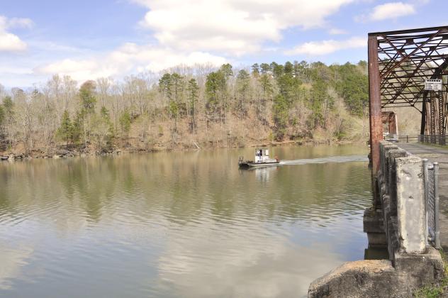 Tom Law / On an early spring day, a Lake Hartwell boater makes his way between the spans of Broken Bridges – traveling directly on the state line of Georgia and South Carolina.