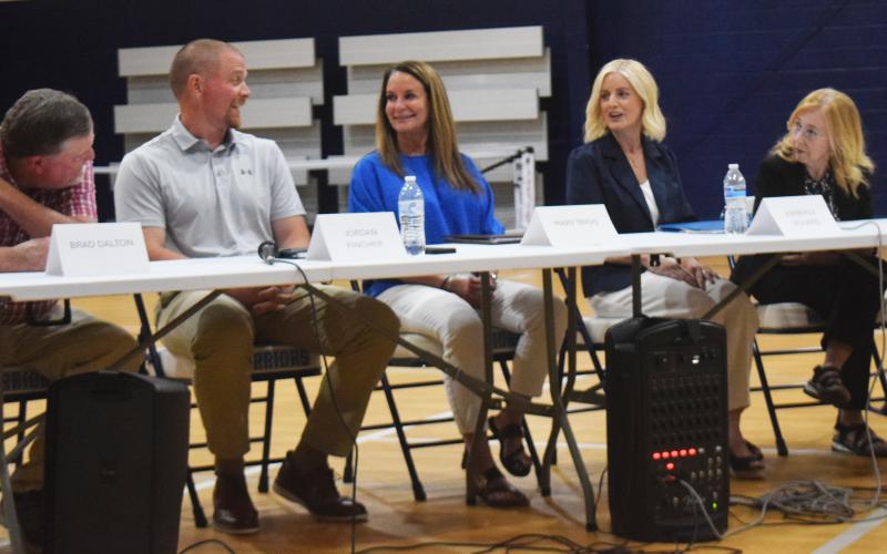 School board candidates, from left, Brad Dalton, Jordan Lee Fincher, Mary Trigg, Kim Rogers and Linda Erbele, share a moment of levity before responding to questions during an April 21 political forum. DENISE ETHERIDGE/WCN