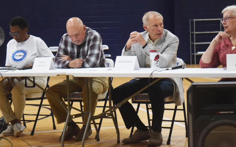 Panelists, from left, Valerie Mateen, Mitch Barrett, Bob Ingram and Diane Kniffin review questions they will ask school board candidates during a GOP hosted forum for White County School Board candidates Tuesday evening. DENISE ETHERIDGE/WCN