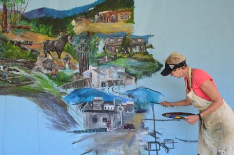 Passers-by along South Main Street in Helen will get a view of a new mural in the works that depicts a century of the community’s history. (Photo/Stephanie Hill)