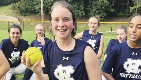 Gabby Whiddon shows off the ball after hitting a game-winning home run in the win over Union County last week. (Photo/WCMS Athletics)