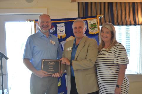 Ron Webb of Sautee Nacoochee (center) receives the 2019 Citizen of the Year Award from White County Chamber of Commerce President Beth Truelove (right) and Chamber executive board member Todd Marks, during the Sept. 3 meeting of the Rotary Club of White County. (Photo/Wayne Hardy)