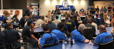Public safety officers gather in the cafeteria of White County High School after the drill. (Photo/William Spernin)