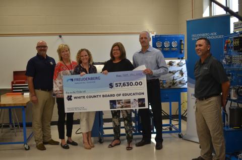 Shown from left are WCHS industrial mechanics teacher Tim Mayo, Assistant Principal Angie Helton, Principal Mary Anne Collier, White County Schools Superintendent Dr. Laurie Burkett, Gary VanWambeke (Freudenberg NOK vice president for Global Lead Center Transmission and Driveline Seals) and Wyman Hare, Cleveland plant manager for Freudenberg NOK. (Photo/Wayne Hardy)