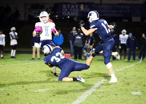 WCHS linebacker Dylan Archer, No. 33, brings down Denmark's Teddy Davenport during the region game last Friday night in Cleveland. (Photo/Staci Sulhoff)