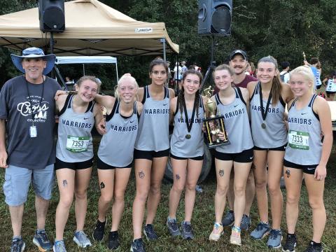The Lady Warriors posted a runner-up finish in the girls' varsity division behind Oconee County. Members of the WCHS squad are, from left, assistant coach Tom O'Bryant, Josie Stover, Reese Vandegriff, Lily Gearing, Sydnee Nix, Maggie Davidson, head coach Matt Dover, Ellie Gearing, and Nealeigh Broadwell. (Photo/WCHS Athletics)