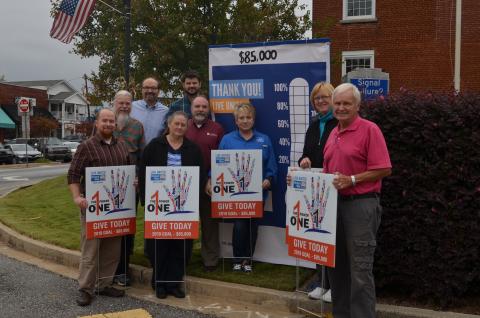 Shown from left at the Oct. 25 unveiling of a fundraising “thermometer” sign in downtown Cleveland are United Way of White County representatives Wayne Hardy, Paul Scott Abbot, Carl Free, Beth Kastner, Nathan Eason, Donald Harris, Denise Loggins, Carol Powel and Gene White. (Photo/Susan Egan)