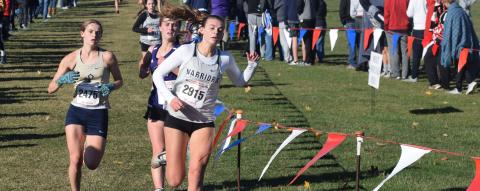 White County's Ellie Gearing, right, holds off St. Pius' Cala McEachron, left, and Chapel Hill's Francie Butts during the final 50 yards of the Class AAAA race to become the first Lady Warrior to cross the finish line. (Photo/Mark Turner)