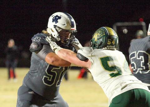 WCHS guard Jacob Anderson, left, locks up with Blessed Trinity defensive lineman Regan Smith during the season finale. (Photos/Staci Sulhoff)