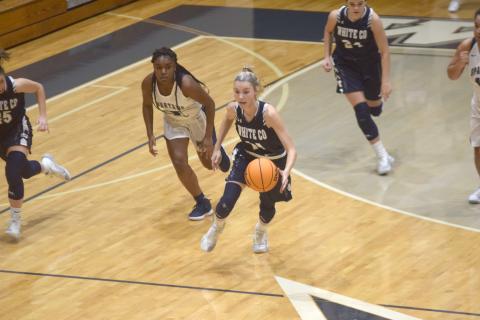 Naomi Crumley pushes the ball up the court during the Lady Warriors' region win over West Hall Tuesday night in Oakwood. (Photo/Mark Turner)