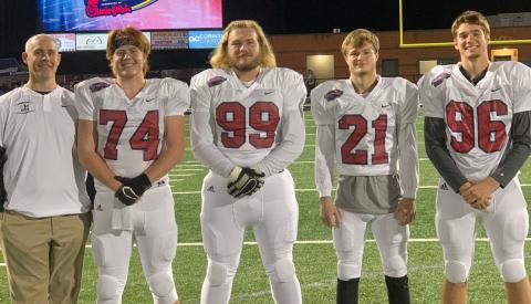 The White County High School football program was well-represented at the Fellowship of Chrisian Athletes East-West All-Star Classic Monday night at North Hall High School. The group consisted of, from left, offensive coordinator Chad Bennett, seniors Cameron Sizemore, Jacob Anderson, Jesse Thomas, and Clay Bolton. The WCHS players were part of the  East team, which dropped a 10-7 decision to the West squad. (Photo/White County FCA)