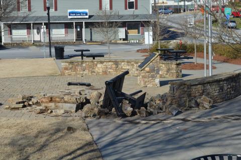 The pursuit ended with the vehicle wrecking at Freedom Park and damaging the brick and stone wall. (Photo/Stephanie Hill)