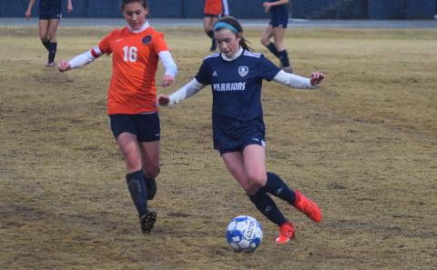 Sydnee Nix, right, beats Habersham Central's Taylor Acker to the ball during Tuesday's match in Cleveland. (Photo/Mark Turner)