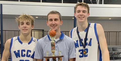 White Creek's Jim Fuller, left, head coach Preston Bowen, and Cameron Hay show off the tournament hardware after winning the Knight's Court Classic. (Photo/WCCA)