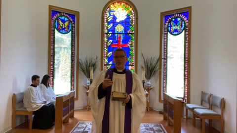 Father Scott Kidd of the Episcopal Church of the Resurrection is using technology (such as recorded video) for worship services.