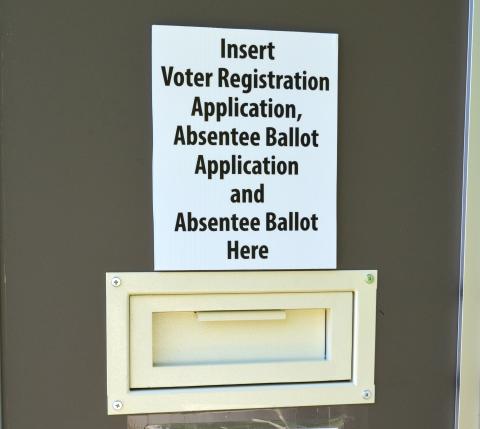 Pictured is the box on the back door at the voter registrar office where residents can drop off their ballots and ballot application. (Photo/Stephanie Hill)