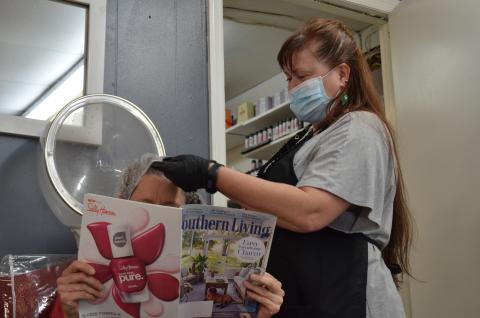 Dee Branson of Creative Styles Hair Salon is among those who felt compelled to reopen for business due to hardships related to the COVID-19 closure. (Photo/Stephanie Hill)