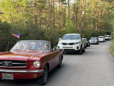 A caravan of neighbors drives by a first responder’s house. (Photo/Theresa Sustakovitch)