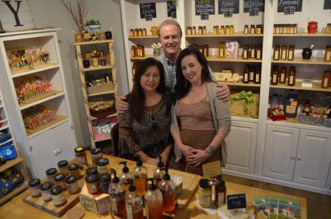 Honey on the Hill owners Anna and Dale Fisher pose with store employee Abigail Thomas in the company’s first retail location in Helen. (Photo/Wayne Hardy)