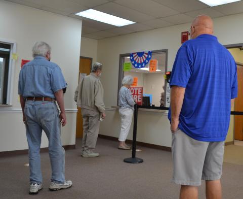 Voters arranged in a socially distanced line wait to cast their ballot Tuesday at the White County Voter Registrar’s Office. (Photo/Stephanie Hill)