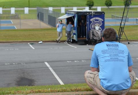 White County High School Assistant Principal Adam Wiley looks at a video production truck in the school parking lot where a “drive-in” graduation ceremony will be held this Friday due to restrictions related to the COVID-19 pandemic. The event will also feature a screen for video and a live broadcast. (Photo/Stephanie Hill)