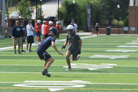 The Warriors, including senior receiver Cooper Turner, right, won't be able to compete in 7-on-7 events in June due to the COVID-19 pandemic. The team will open summer workouts next week at the high school complex. 
