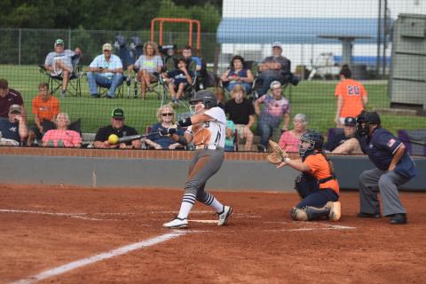 Annika Vandiver connects with a pitch during the Lady Warriors' scrimmage against Habersham Central Tuesday in Cleveland. (Photo/Mark Turner)