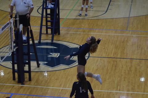 Senior Jenna Ash had a team-high 10 kills in the region opening win. (Photos/Mark Turner)