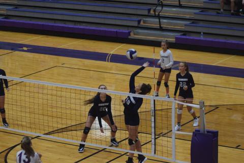 Jenna Pratt goes high for a kill during the semifinal match against Lumpkin County last Saturday in Dahlonega. (Photo/Mark Turner)