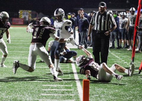 Dawson County's Hayden McKinney, left, and Tripp Caine stop White County's Darius Cannon a few yards short of the end zone during the first half of the Region 7-AAA opener last Friday night in Dawsonville. (Photo/Mark Turner)