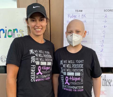 Esta Johnson, left, and Kaden Wilson show of the T-shirts that are being sold to support Wilson and his family. (Photo/Esta Johnson)