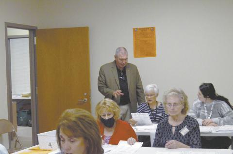 White County Elections Superintendent Garrison Baker (standing) speaks with an audit team Friday, Nov. 13, as a hand count of paper ballots began. (Photo/Wayne Hardy)