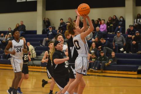 Josh Adams, above, and the seventh-grade boy's team posted a 35-19 opening round win Tuesday over Lumpkin County.  (Photo/Mark Turner) 