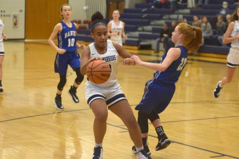 Kiannah Dorsey protects the ball during a recent eighth-grade girls game. (Photos/Mark Turner)