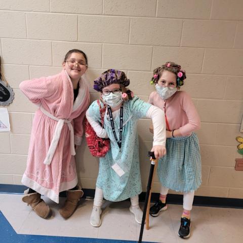 Fourth grade students Emily Roberts, Audrey Whitaker, and Harper Murphey dressed up as 100-year-old ladies.  (Submitted photos)