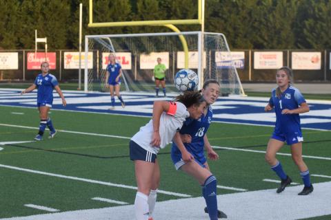 White County's Sydnee Nix, left, collides with Oconee County's Perrin Pennington during the Sweet 16 game Monday in Watkinsville. (Photo/Mark Turner)