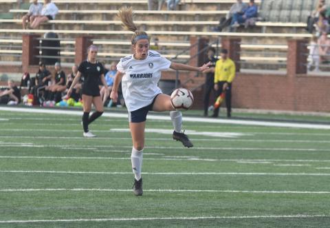 Ada Smith and the Lady Warriors dropped a 3-0 decision Tuesday to West Forsyth. (Photo/Mark Turner)