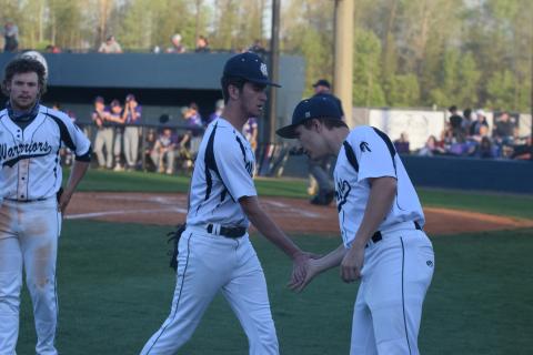 Jacob Matthewson, right, congratulates Caleb Reddy as he walks off the field following the fifth inning of the win over Cherokee Bluff. (Photos/Mark Turner)