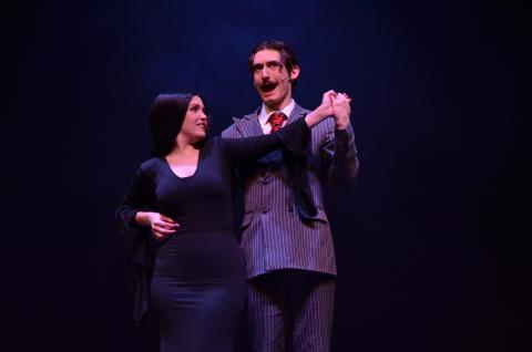 Ben Perrin, who plays Gomez Addams, and Ireland Ballington, who plays Morticia Addams, danced together during the opening number of dress rehearsals on Monday, April 19.