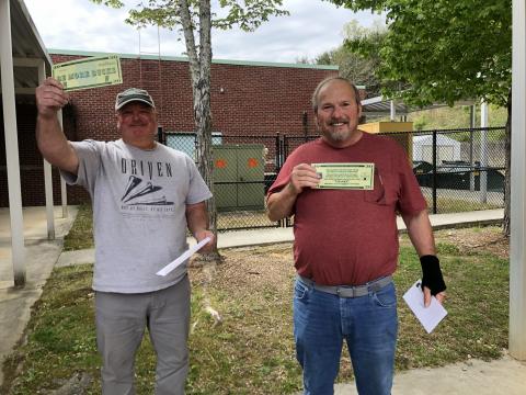 School bus drivers Avery Clark and Mike Ray react to surprise “Be More Bucks” presentations noting they would receive an additional $2,020 bonus on top of $1,000 previously promised by Gov. Brian Kemp. (Submitted photo)