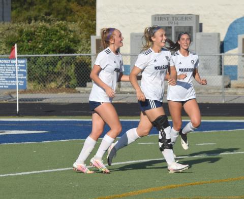 White County's Hazen Ramey, left, Madison Hunter, and Leah Alexander are all smiles after Hunter's unassisted goal gave the Lady Warriors a 4-0 lead over Ringgold Monday in the opening round of the AAA playoffs. The Lady Warriors face Oconee County next Monday in a Top 5 battle in a second round matchup. (Photo/Mark Turner)