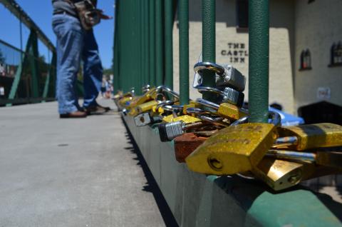 Pictured are locks that were on the bridge as of June 15. Because of the weight of all the locks over time, they have to be removed from the bridge. (Photo/Stephanie Hill) 